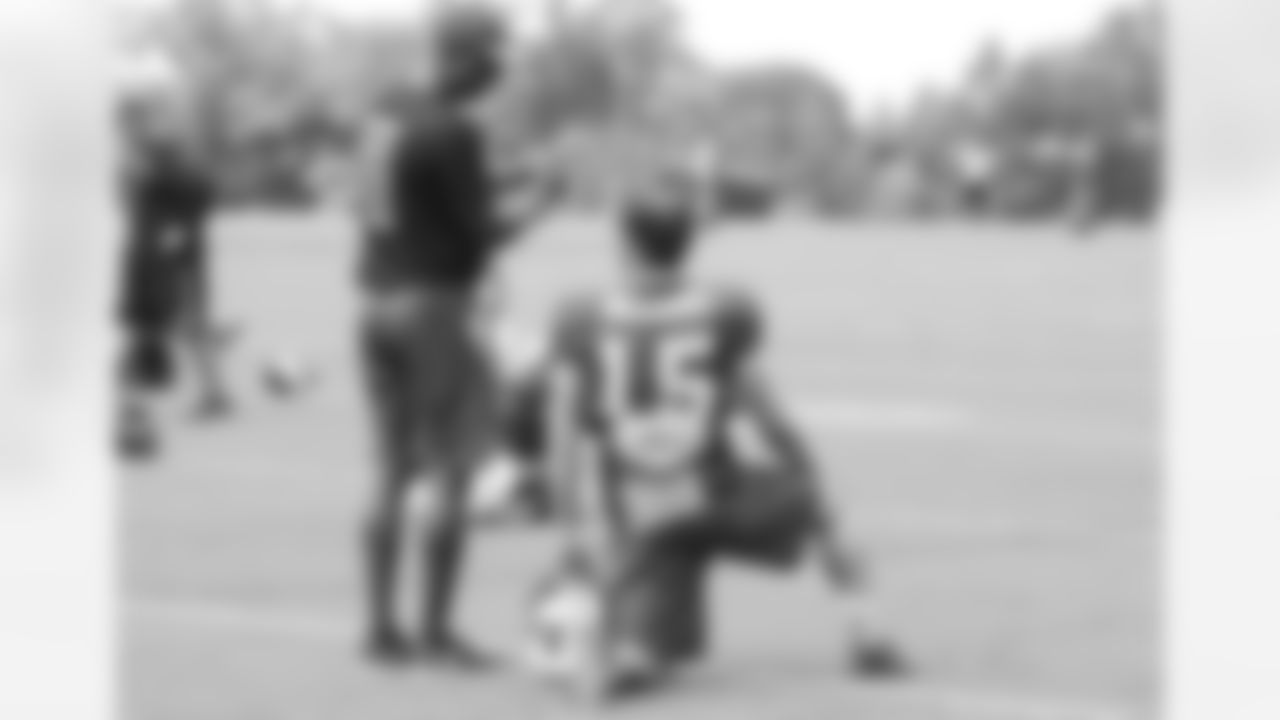 Keith Armstrong, speacial teams coordinator, talks to WR Nick Williams