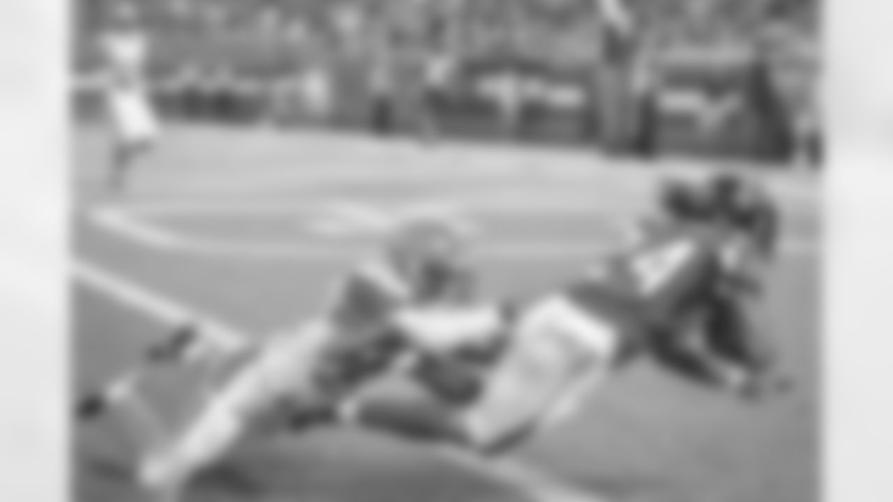 RB Devonta Freeman dives for a touchdown against Cleveland Browns FS Jordan Poyer