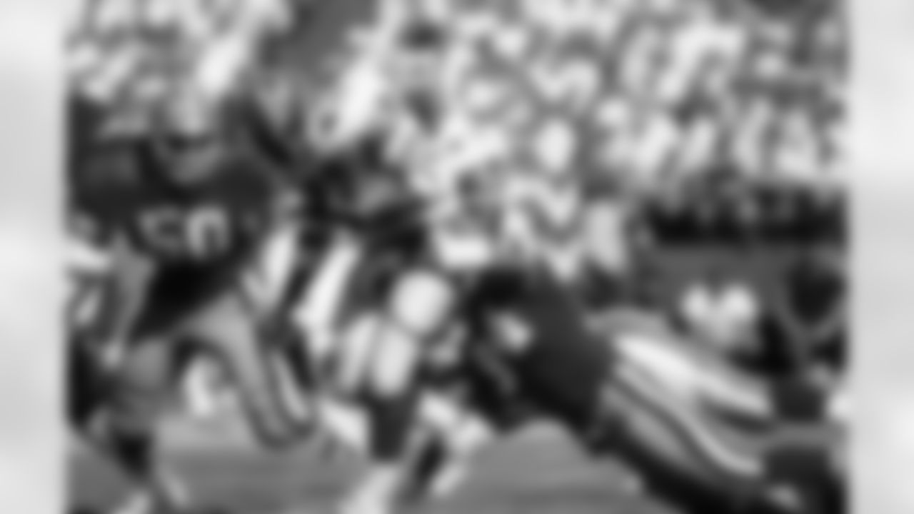 Falcons RB Gerald Riggs carries the football and is tackled by 49ers DE Charles Haley during the Falcons 34-17 victory over San Francisco on September 19, 1988