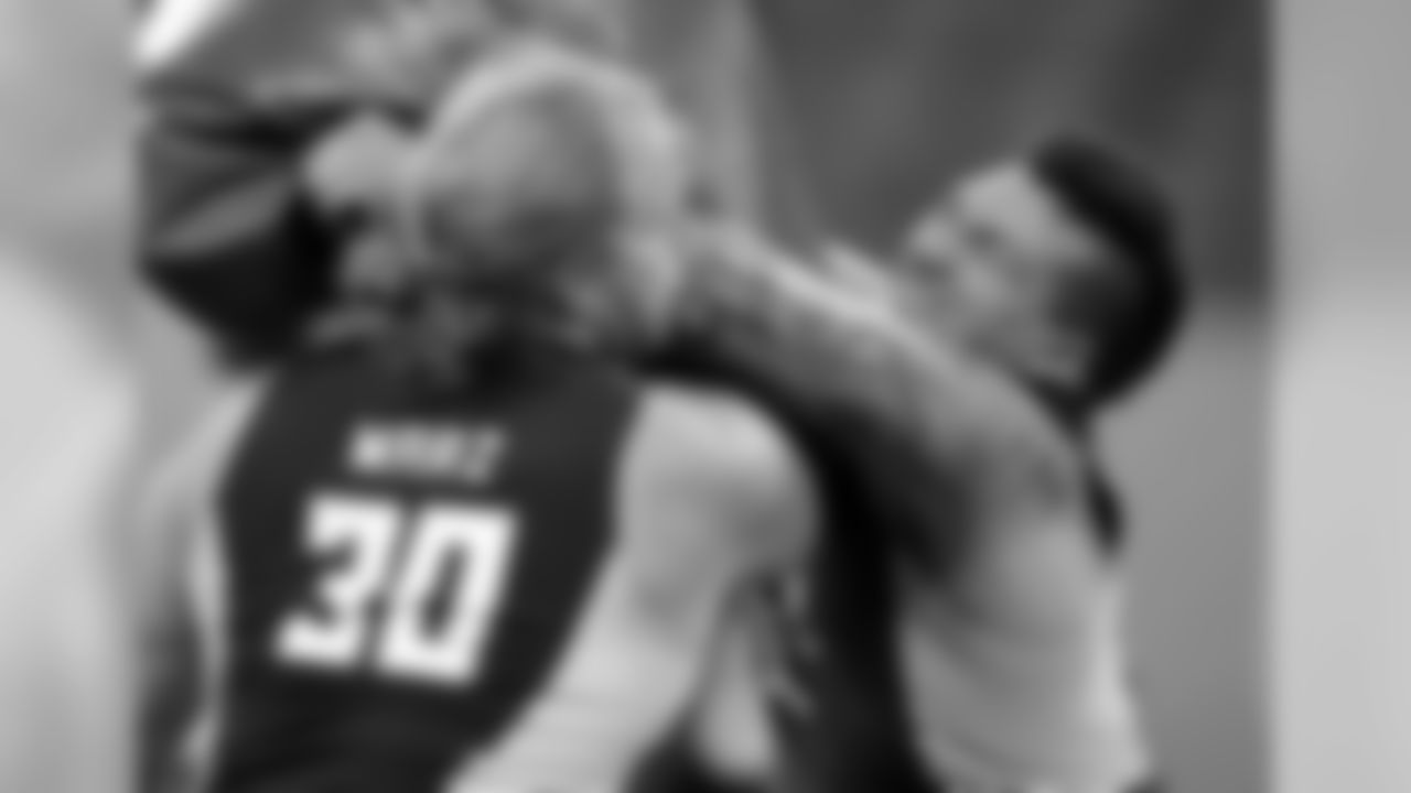 Wisconsin offensive lineman Tyler Marz, left, and UCLA offensive lineman Alex Redmond
