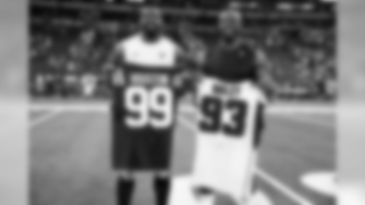 Atlanta Falcons defensive end Allen Bailey #93 (left) meets with Indianapolis Colts defensive end Justin Houston #99 (right) after the game at Lucas Oil Stadium in Indianapolis, Indiana, on Sunday September 22, 2019. (Photo by Kara Durrette/Atlanta Falcons)