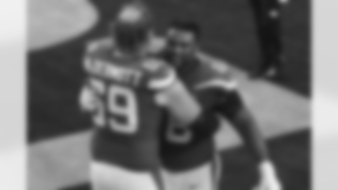 New York Jets offensive tackle Conor McDermott (69) and offensive guard Josh Andrews (68) celebrate following an NFL football game against the Los Angeles Rams, Sunday, Dec. 20, 2020, in Inglewood, Calif. (Ben Liebenberg via AP)