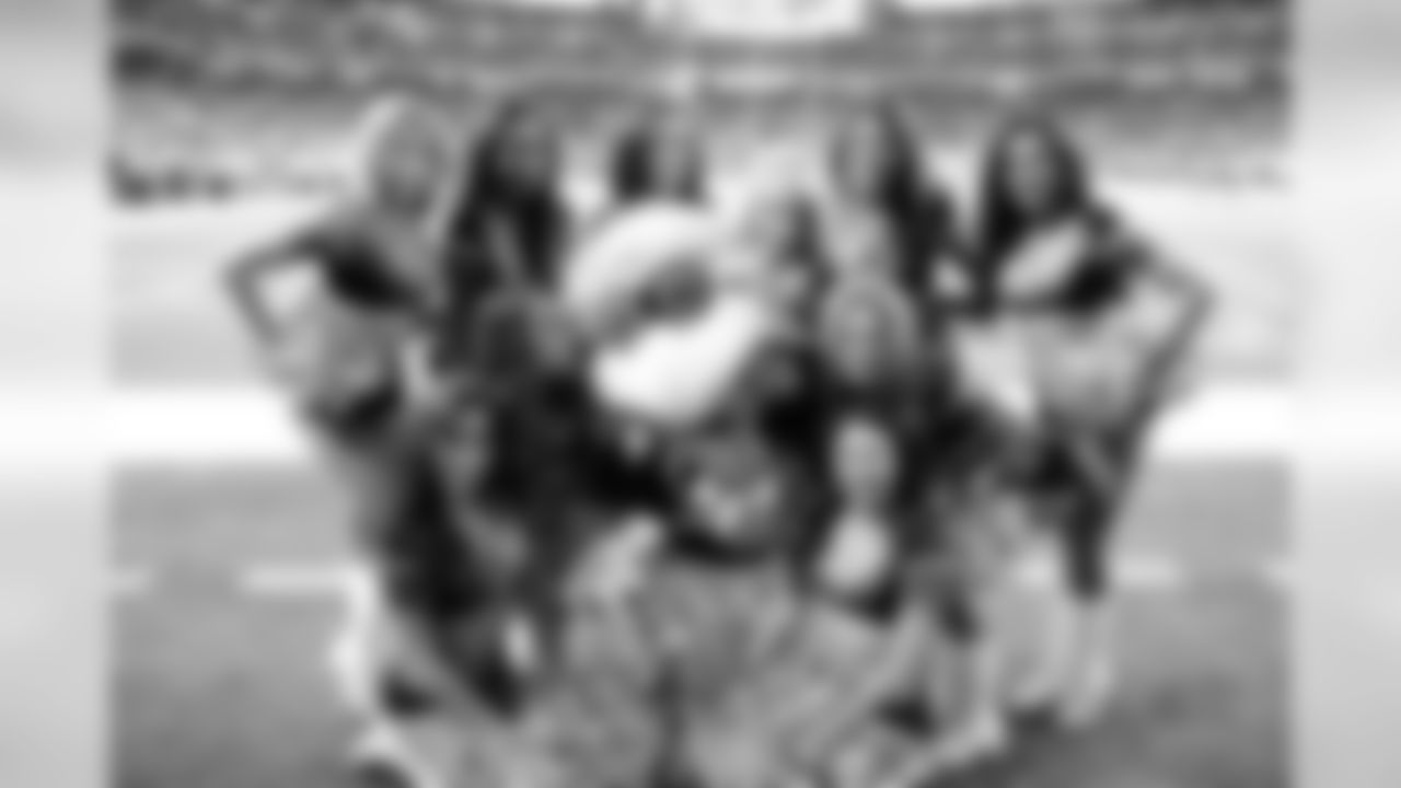 A few of the Atlanta Falcons Cheerleaders gather around Freddie Falcon (PHOTOS: Art Morrison, Special to AtlantaFalcons.com)