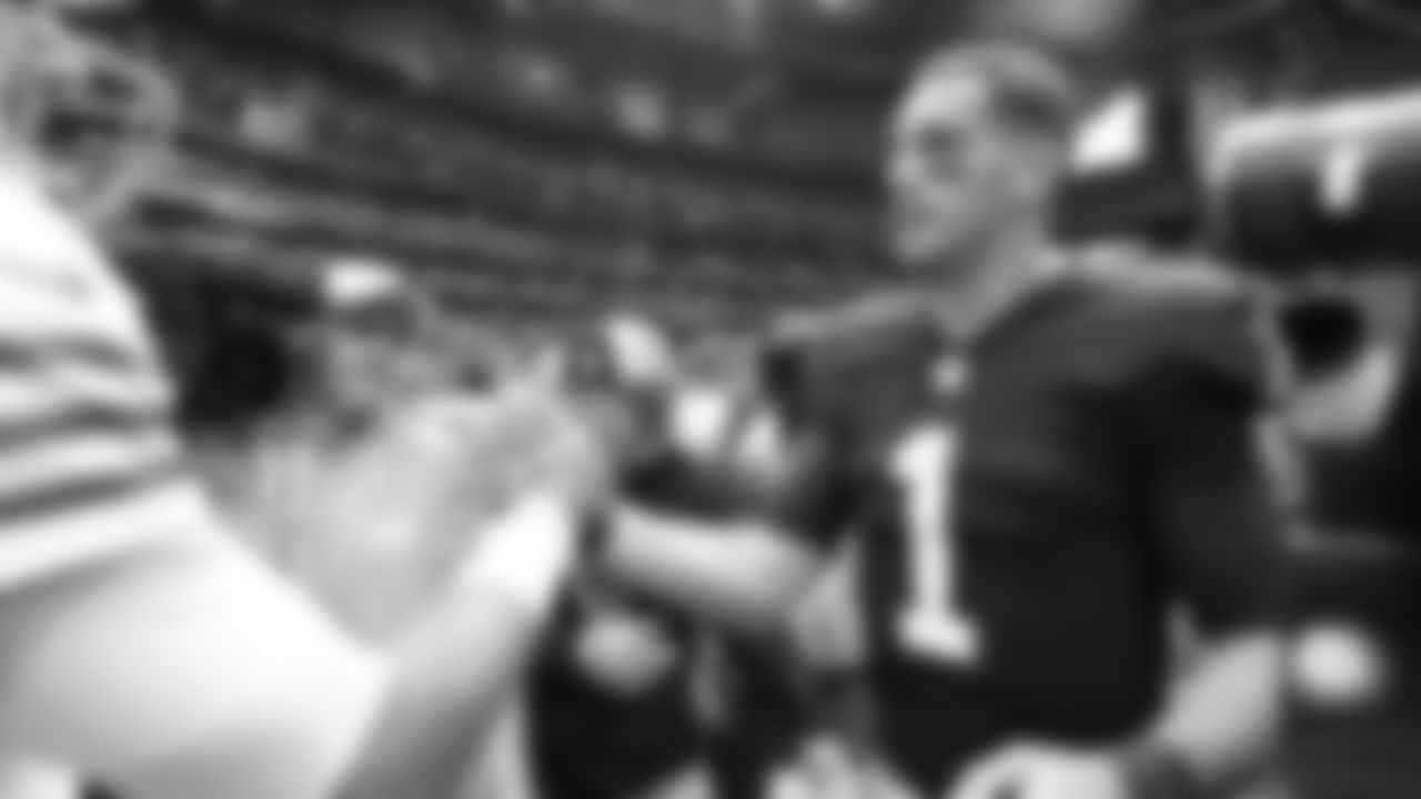 Atlanta Falcons quarterback Marcus Mariota #1 talks with San Francisco 49ers quarterback Jimmy Garoppolo #10 after their game at Mercedes-Benz Stadium in Atlanta, Georgia on Sunday, October 16, 2022. (Photo by Mitchell Martin/Atlanta Falcons)