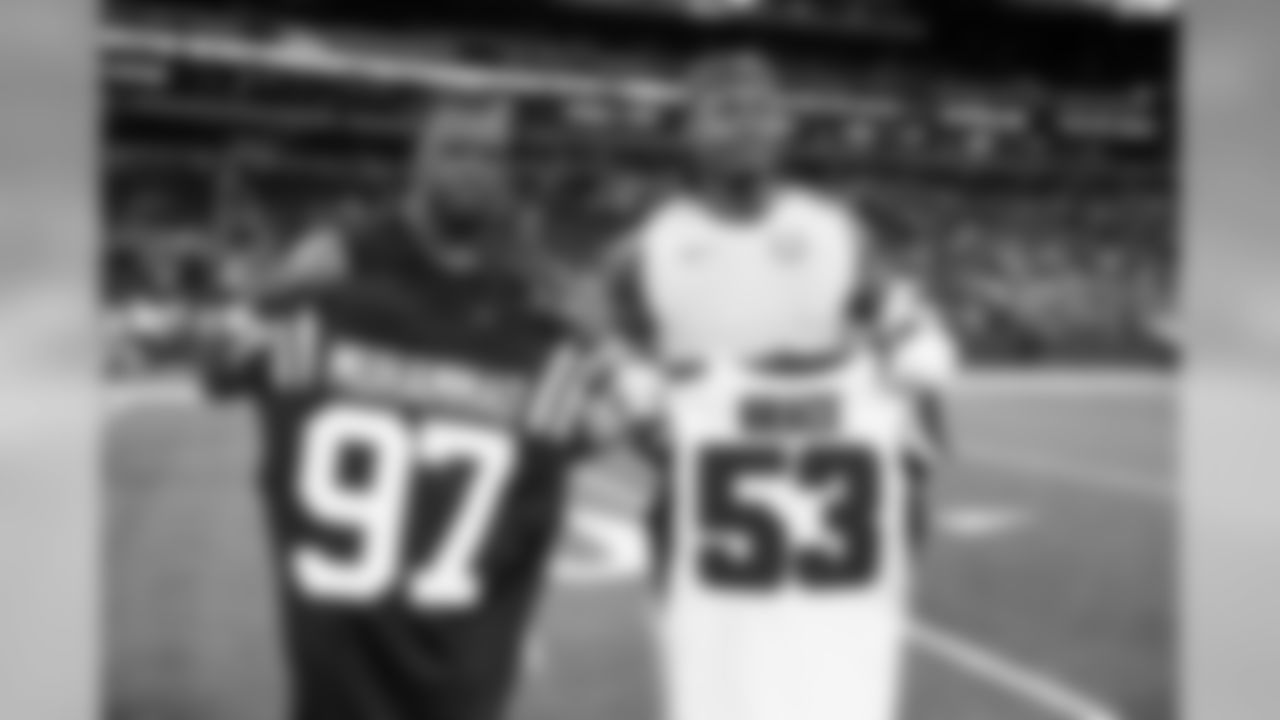 Atlanta Falcons linebacker Jermaine Grace #53 (left) meets with Indianapolis Colts defensive tackle Al-Quadin Muhammad #97 (right) after the game at Lucas Oil Stadium in Indianapolis, Indiana, on Sunday September 22, 2019. (Photo by Kara Durrette/Atlanta Falcons)