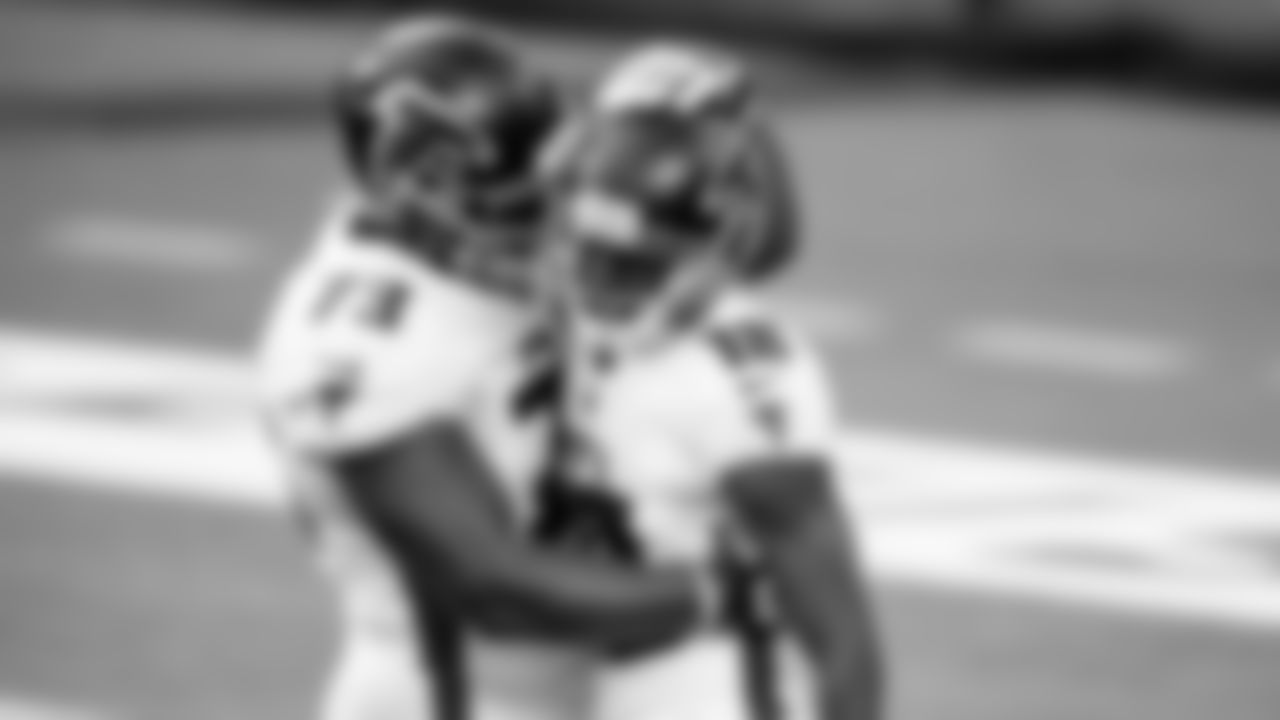 Atlanta Falcons offensive tackle Matt Gono #73 hugs wide receiver Calvin Ridley #18 after he scored a touchdown in the first half against the Los Angeles Chargers on December 13, 2020.