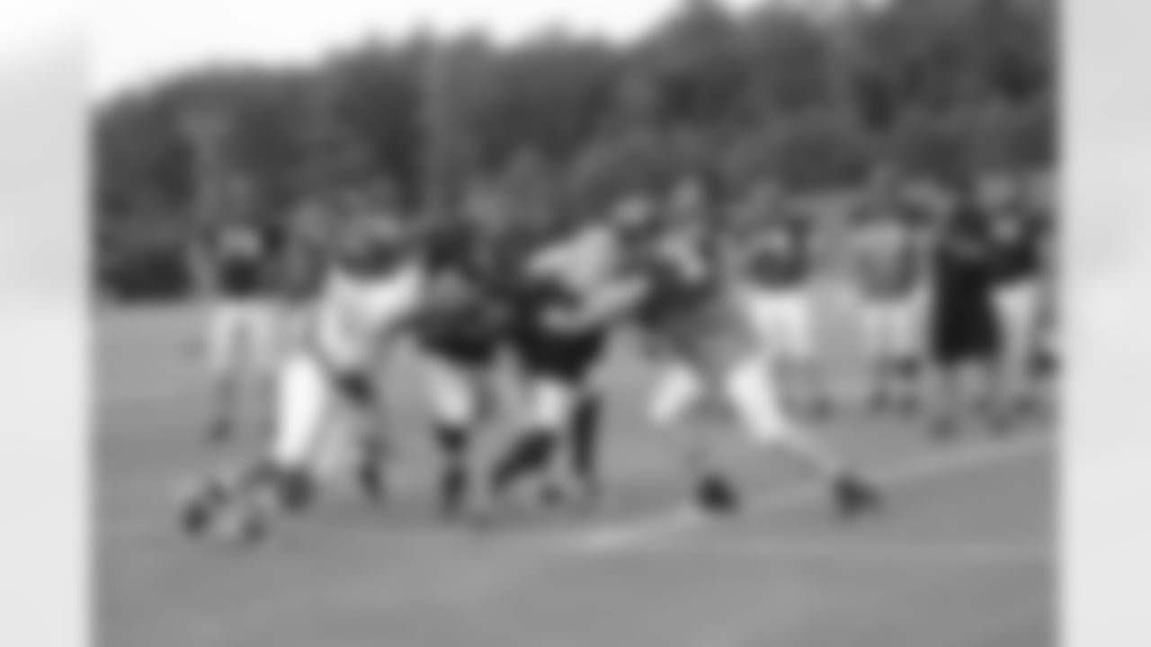 The offensive and defensive line work a drill // 2011 Russell Athletic Training Camp - Day 6 // August 2, 2011 // Flowery Branch, Ga. —