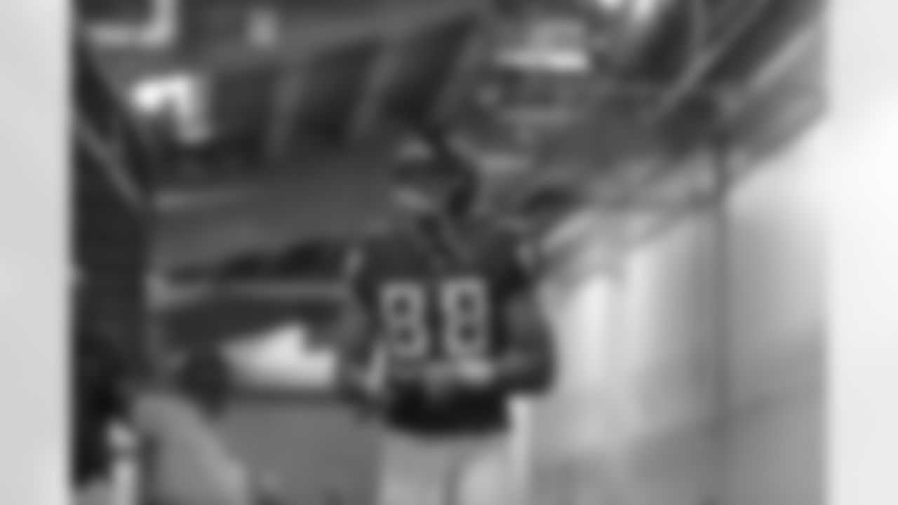TE Tony Gonzalez exits the locker room