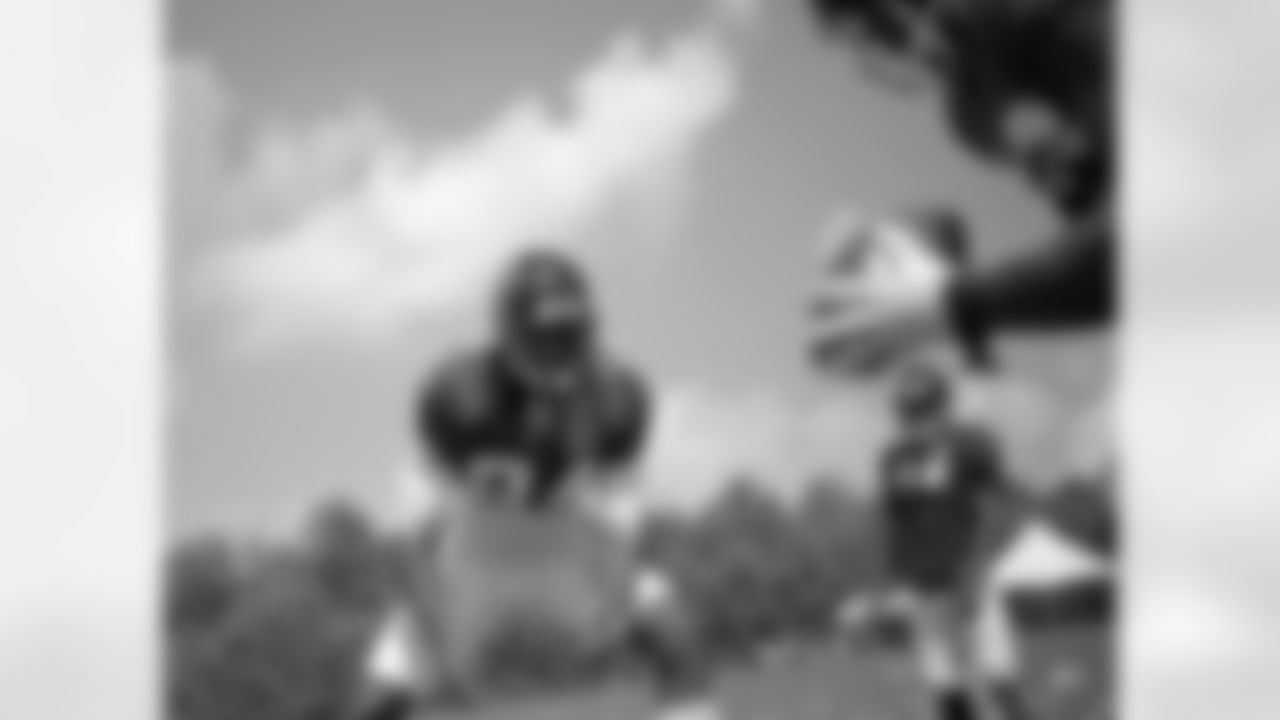 Atlanta Falcons Roddy White, left, runs through a drill during training camp