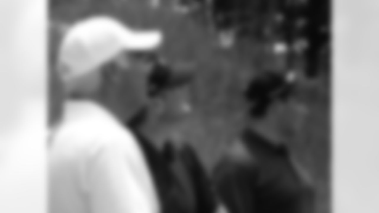 Coach Smith, left, GM Thomas Dimitroff, middle, and Verizon executive Jeff Mango watch a tee shot // Seventh Annual Verizon Network of Champions Golf Tournament // 6/13/11 // Suwanee, Ga. -