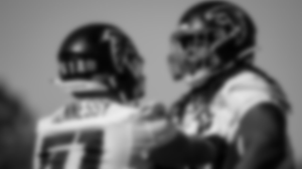 Atlanta Falcons offensive guard James Carpenter #77and center Matt Hennessy #61 work together during practice at IBM Performance Field.