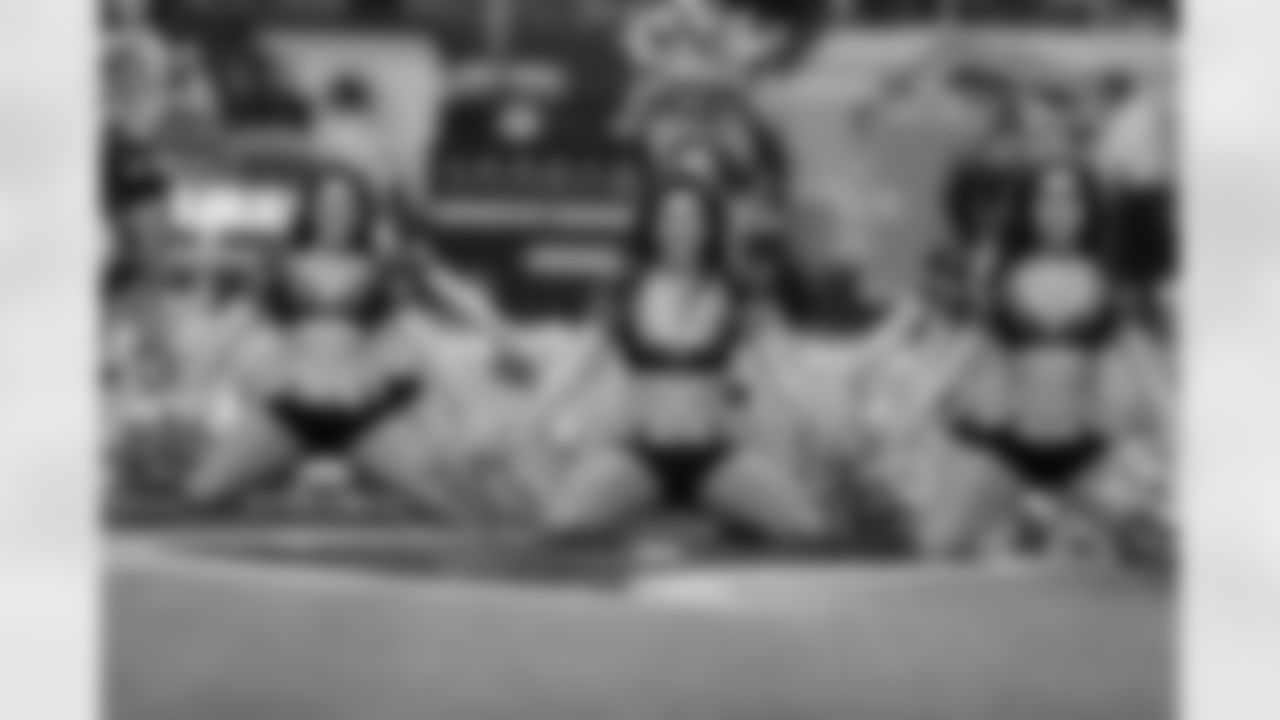 The Atlanta Falcons Cheerleaders perform on the field before the Falcons vs. Cowboys game begins