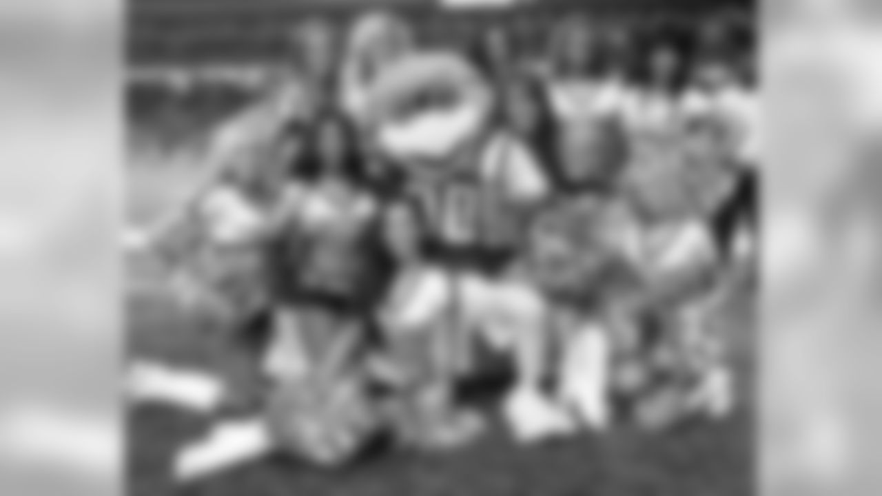 The Falcons cheerleaders pose with Freddie Falcon // Falcons vs. Dolphins - Cheerleaders // August 12, 2011 // Atlanta -