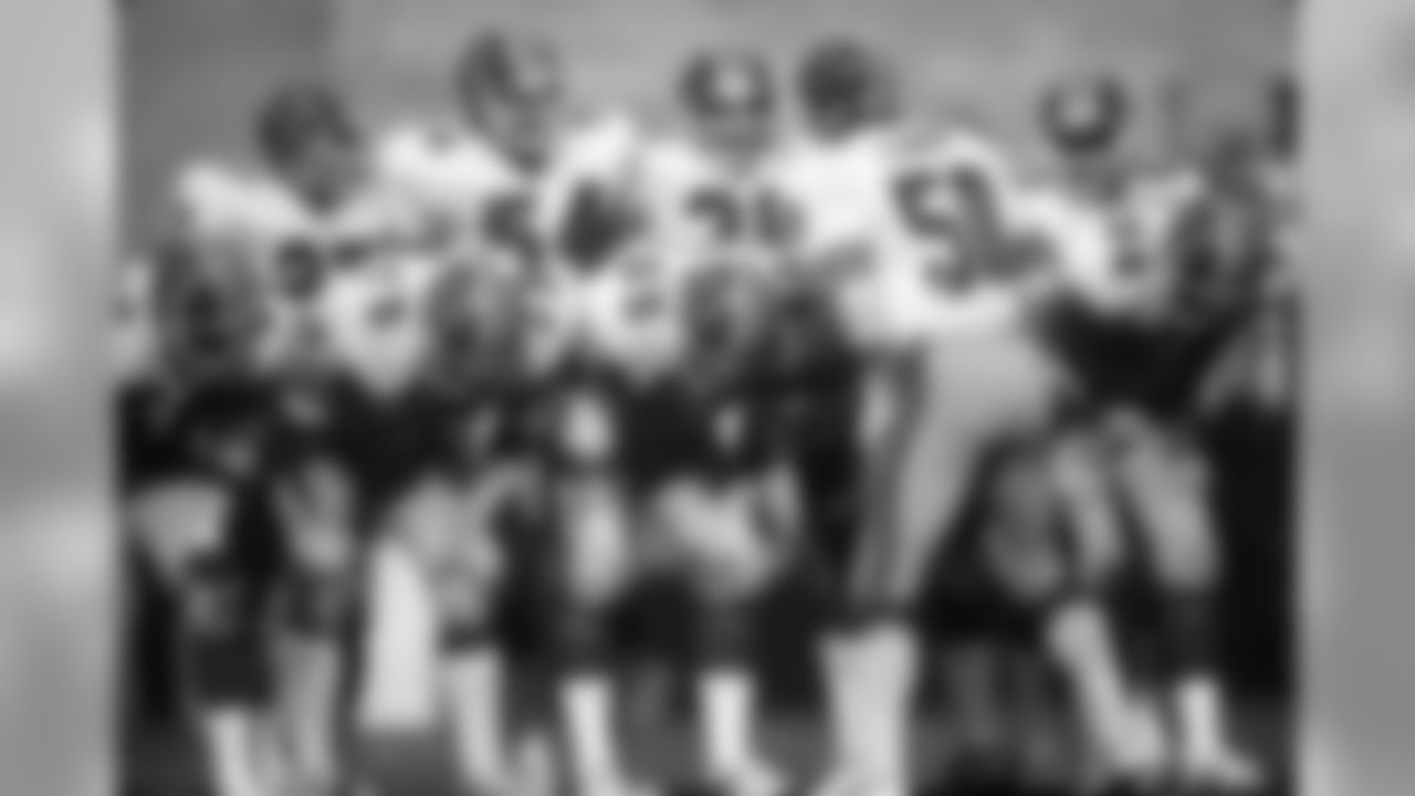 LB Buddy Curry huddles with teammates during an NFL game against the Los Angeles Rams at Anaheim Stadium on December 21, 1980. The Rams defeated the Falcons 20-17. (Peter Read Miller via AP)
