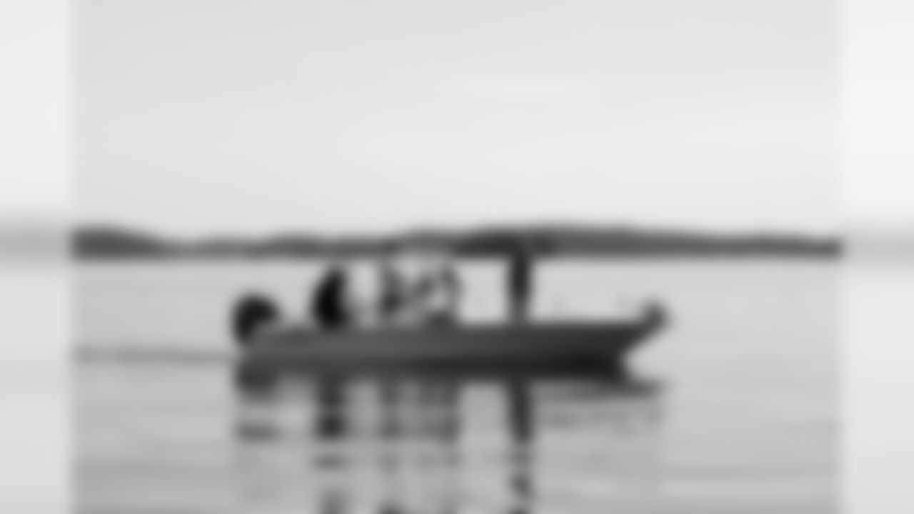 Kroy Biermann and Trey Bryant wave as they enjoy the afternoon fishing with