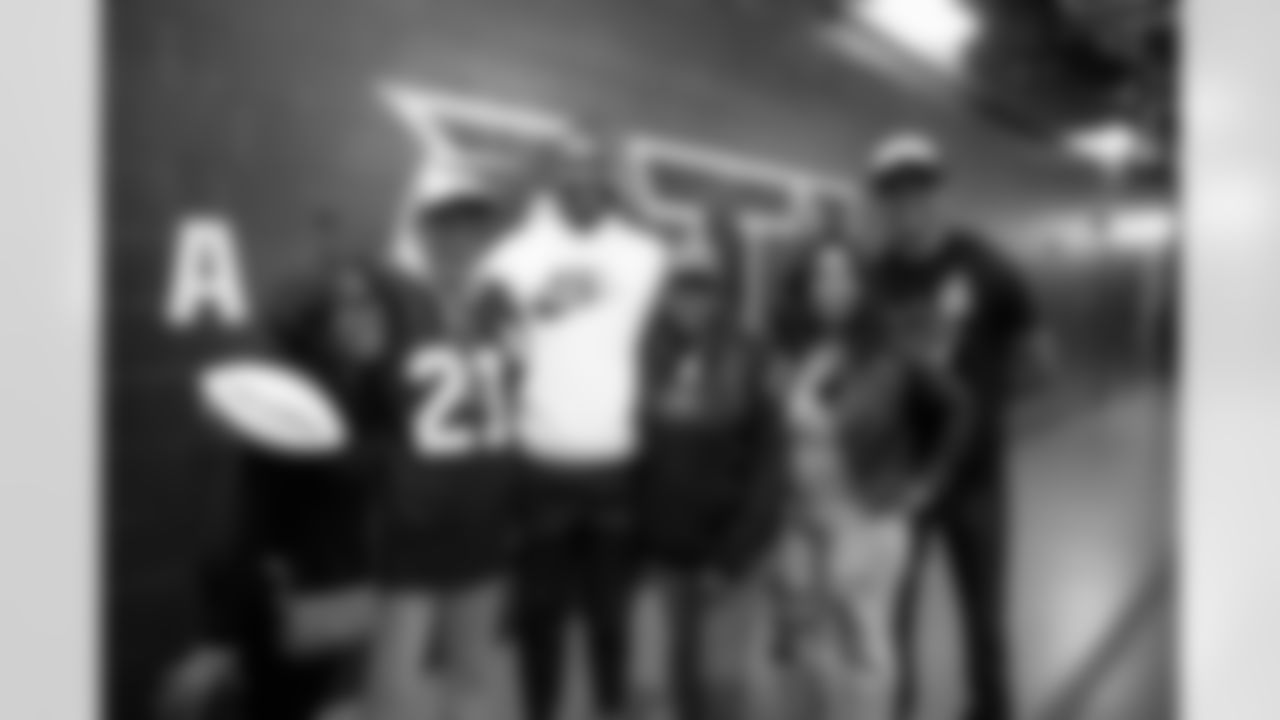 Henry Ison, Falcons Legend Roddy White, friends and family. The Falcons Season Ticket Member has been named the 2021 NFL Fan of the Year presented by Captain Morgan.