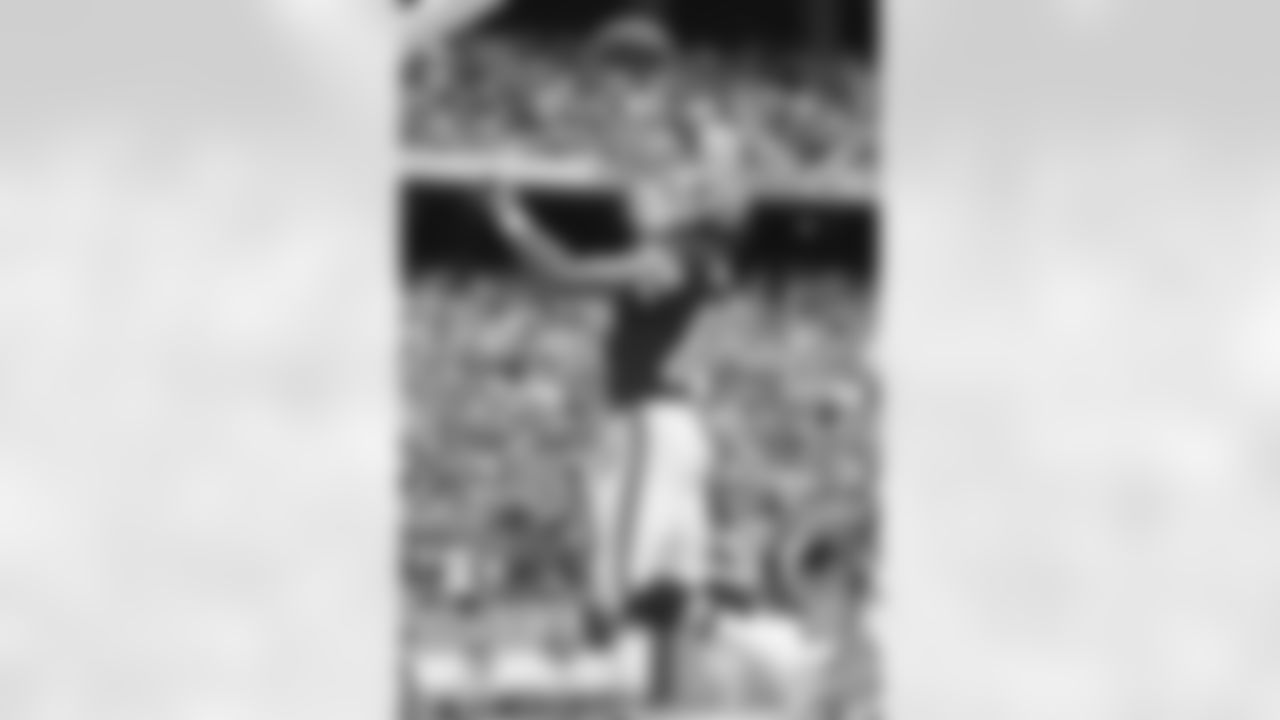 After breaking the NFL record for touchdown receptions by a tight end against the Bengals, Tony Gonzalez celebrates by dunking the football at the Oct. 14, 2007 game.
