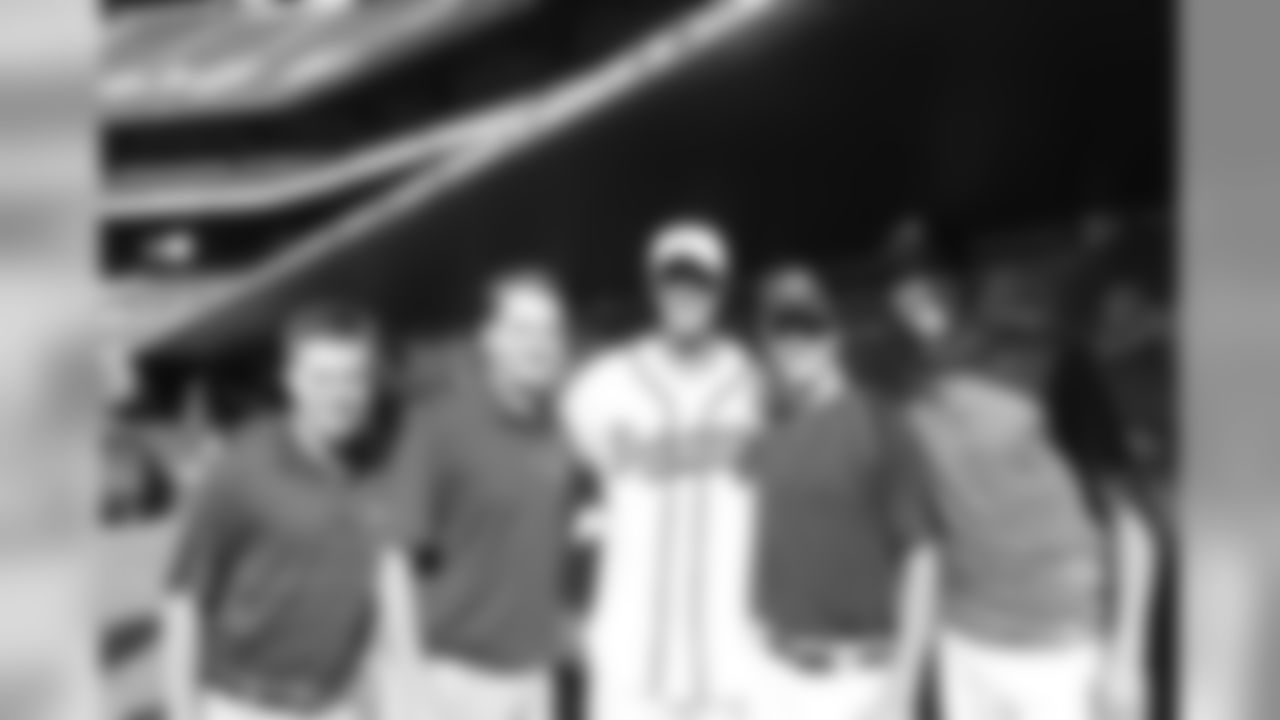 Matt Ryan pauses to snap a photo with the Braves Clubhouse staff before the