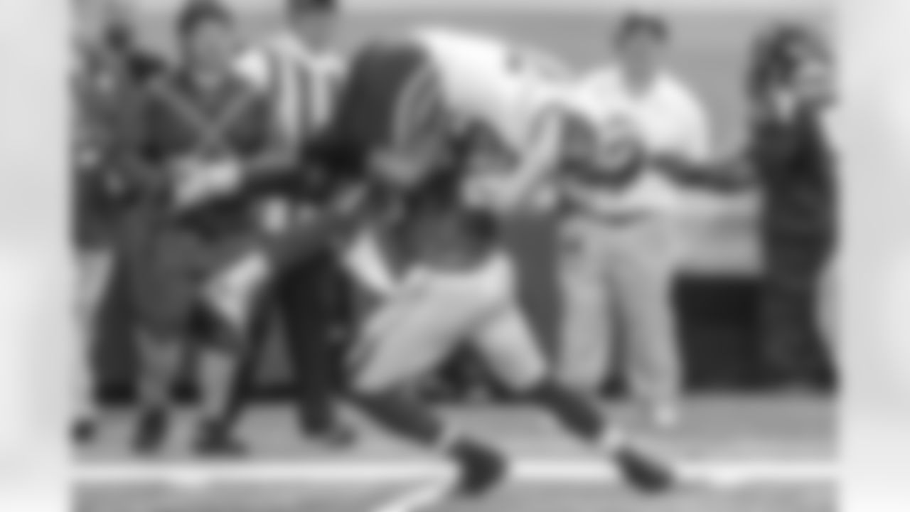 Safety William Moore delivers the sidewalk slam on Rams tight end Mike McNeill