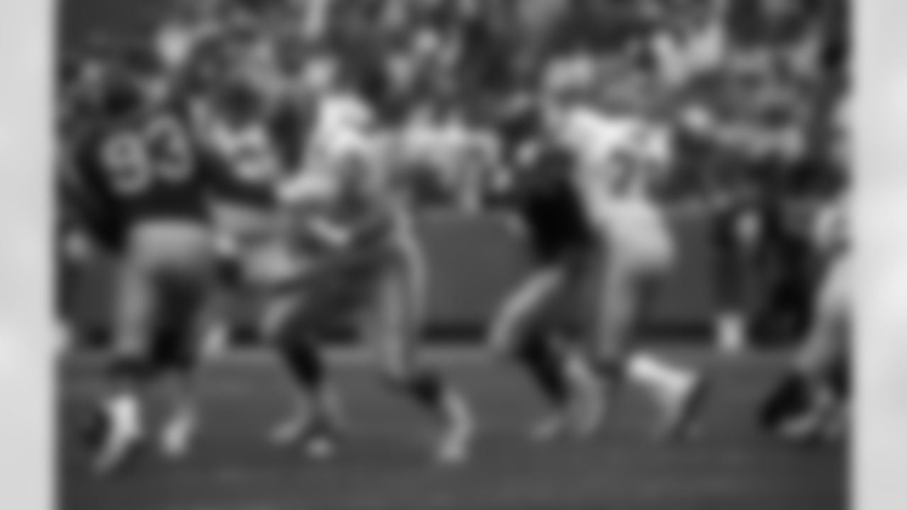 Falcons offensive linemen Glen Howe and Mike Kenn block defenders during a game against the Rams on October 26, 1986
