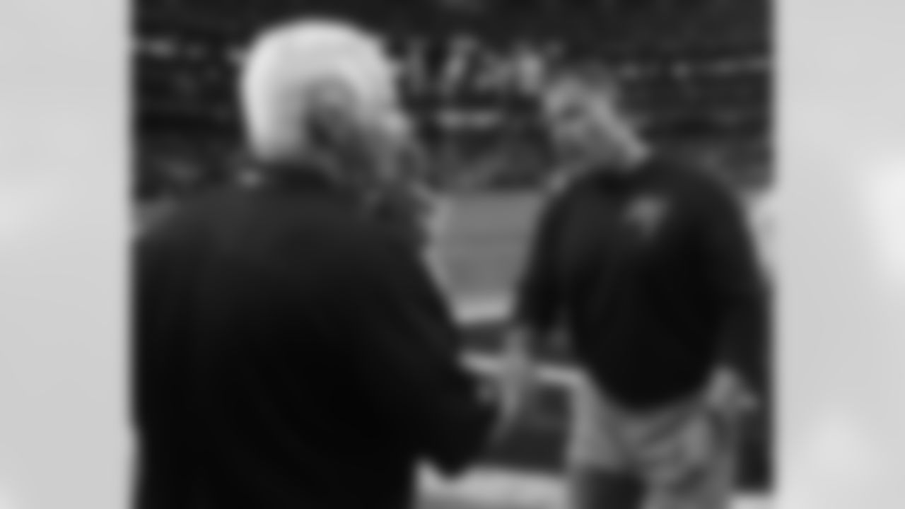 Head coach Mike Smith shakes hands with Buccaneers head coach Greg Schiano