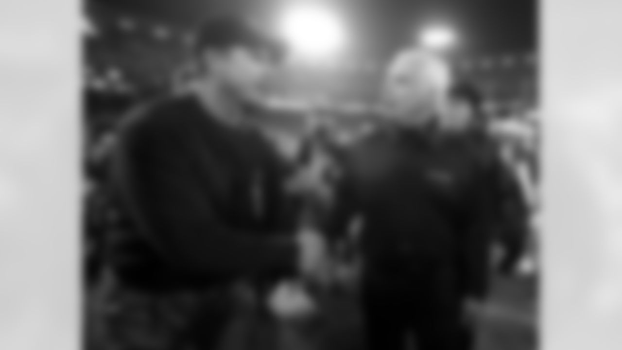 Head coach Mike Smith shakes hands with 49ers head coach Jim Harbaugh after the game