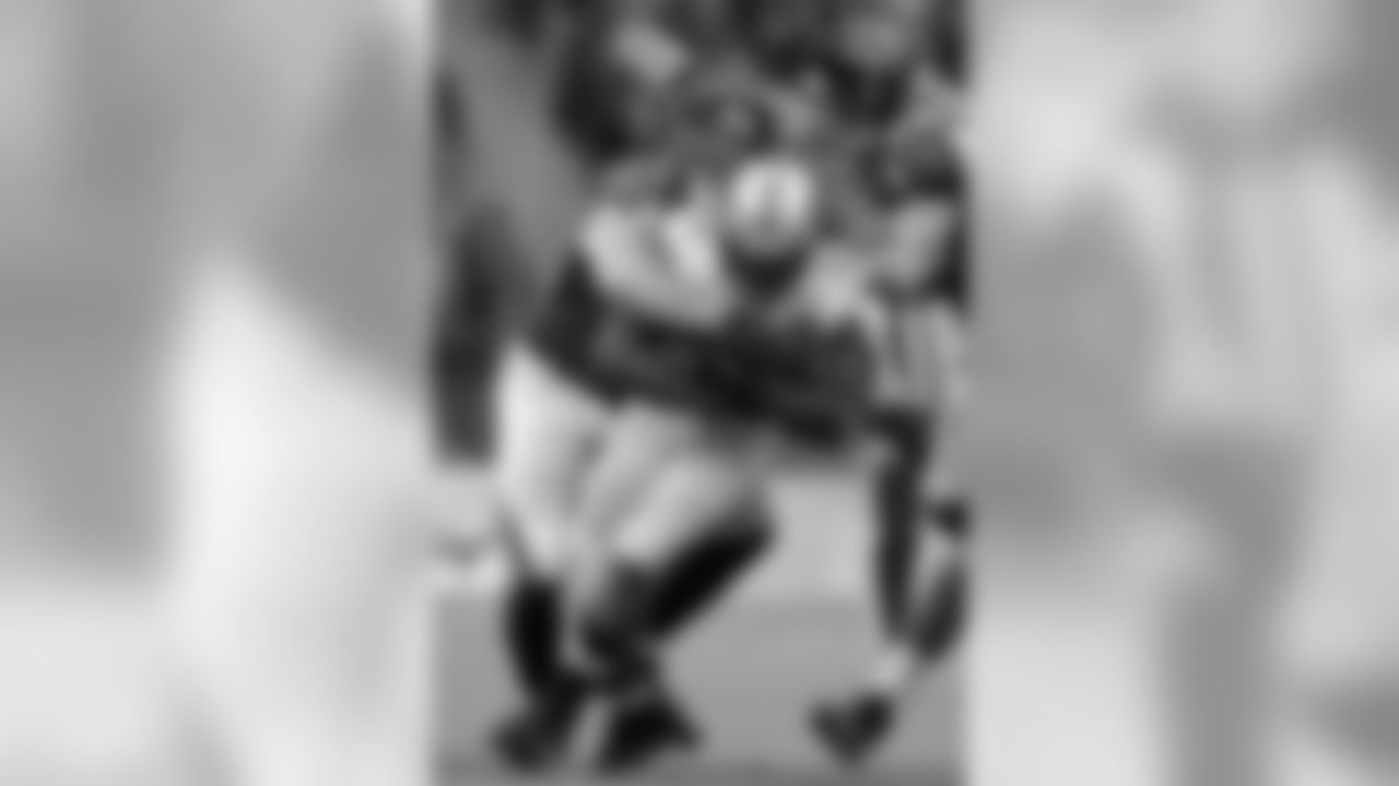 DE Kroy Biermann and LB Paul Worrilow combine to make a tackle