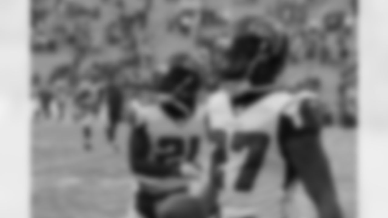 DB Robert McClain decides to go sleeveless in the bitter cold elements.