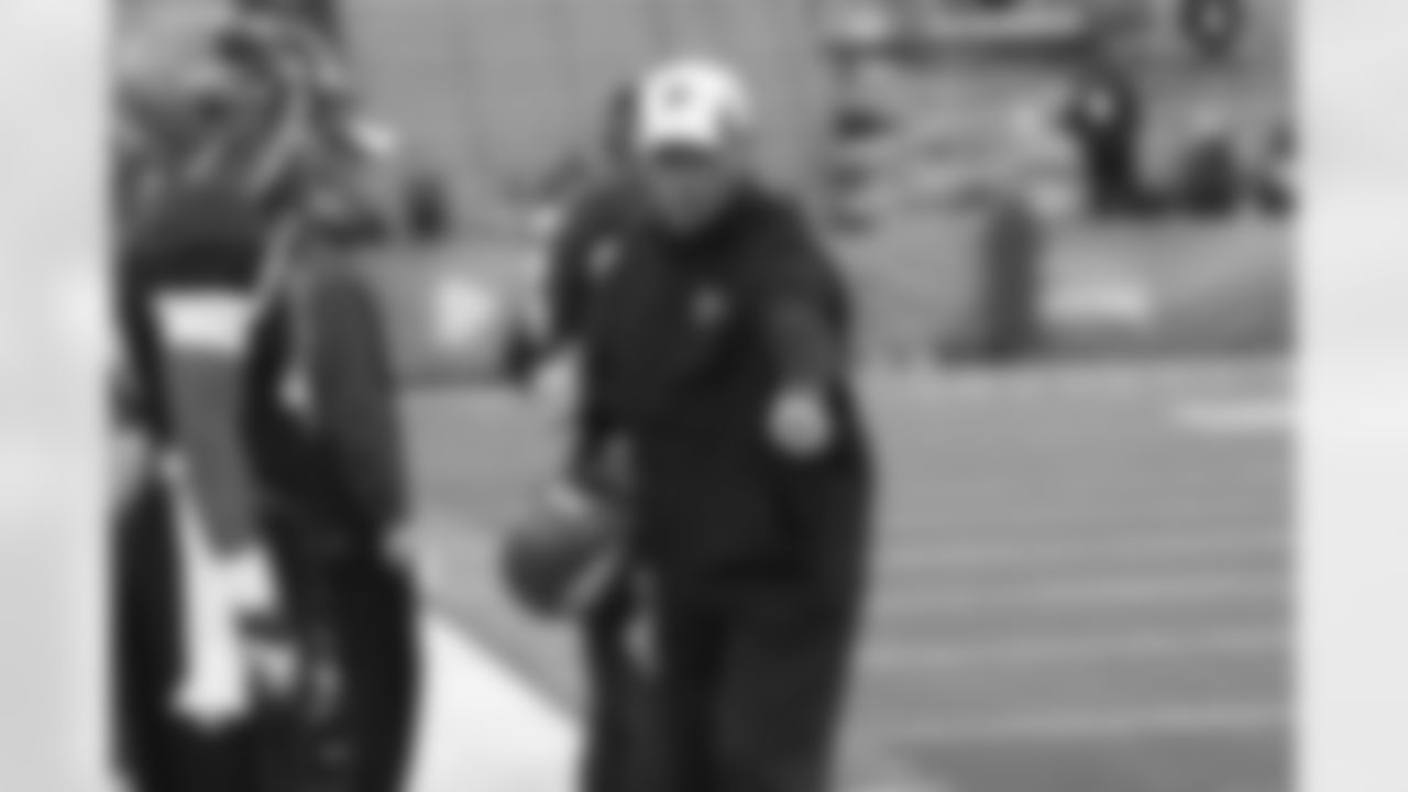 Falcons linebackers coach Glenn Pires works with his players.