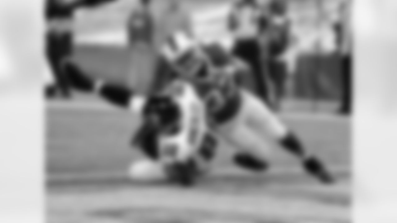 TE Tony Gonzalez lands in the end zone after making a catch
