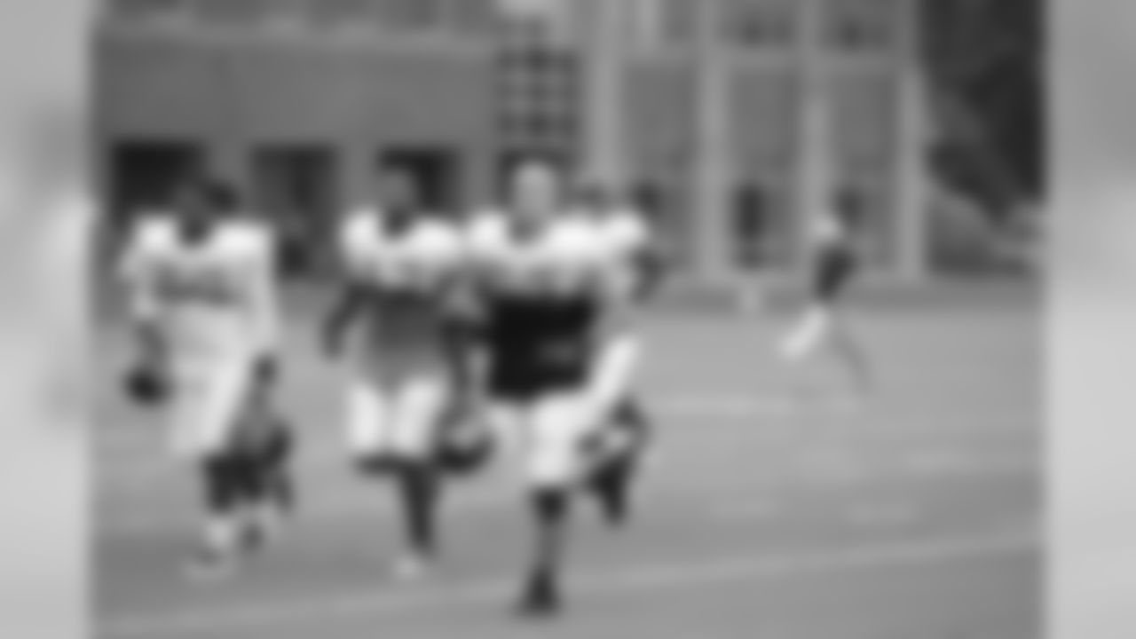 Coy Wire leads the linebackers to the next drill // 2011 Russell Athletic Training Camp - Day 7 // August 7, 2011 // Flowery Branch, Ga. -