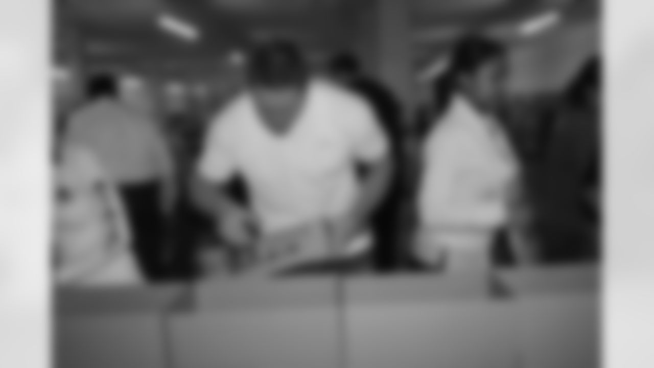 Publix Food for Sharing // December 14, 2010 // Kroy Biermann taking part in the assembly line approach, in effort to send out thousands of meals to the hungry // Atlanta, GA //