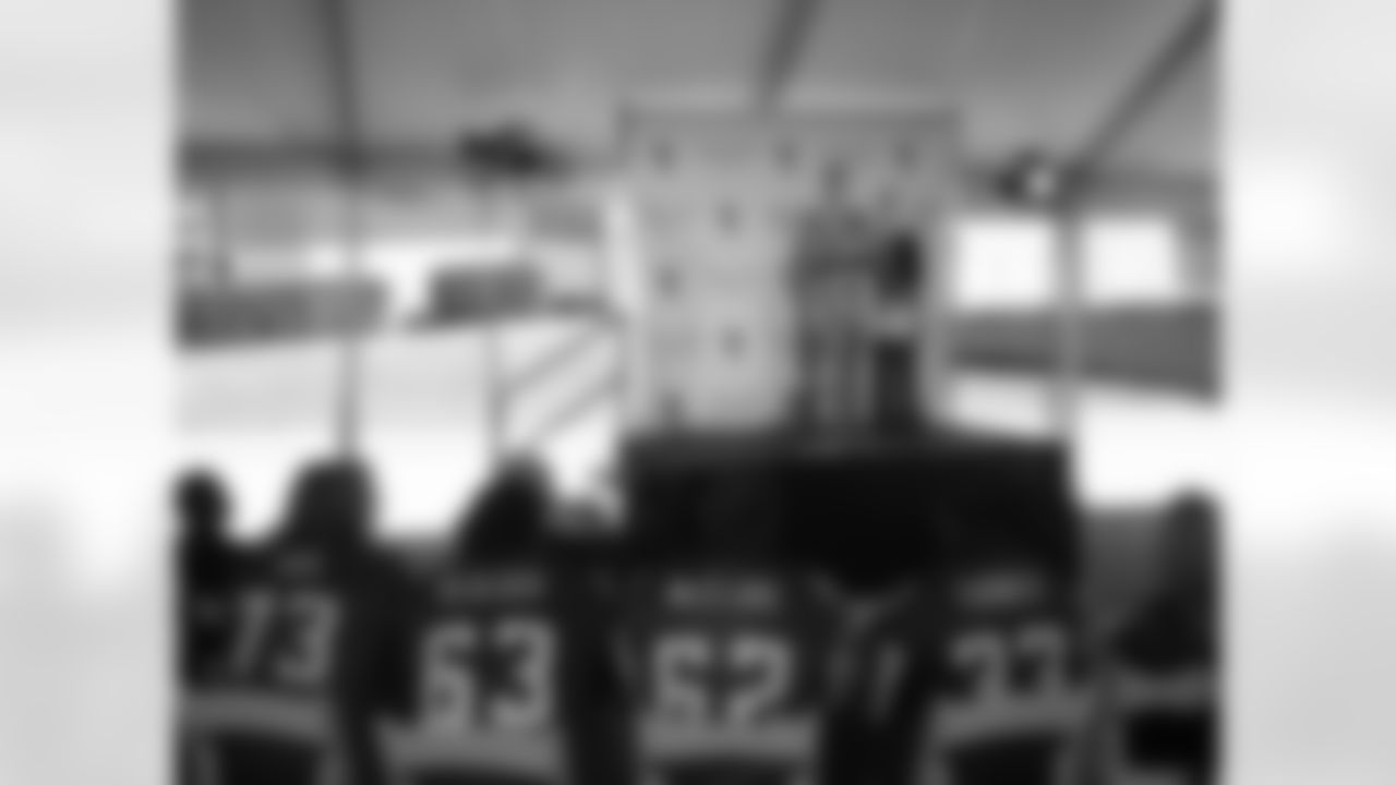 Players look on as Centennial Place YMCA is renamed in honor of team honor