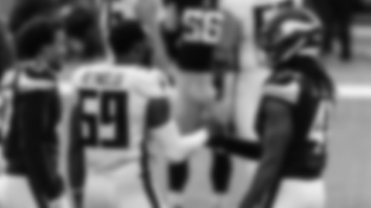 Atlanta Falcons linebacker LaRoy Reynolds #59 shakes hands with Minnesota Vikings free safety Anthony Harris #41 after the game on October 18, 2020. (Photo by Cato Cataldo/AtlantaFalcons)