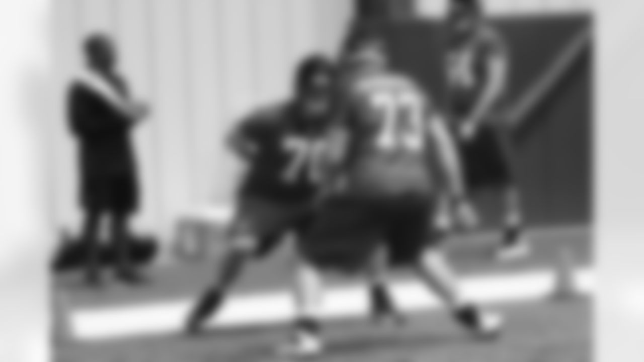 Tackles Ryan Schrader and Will Post work together on a drill