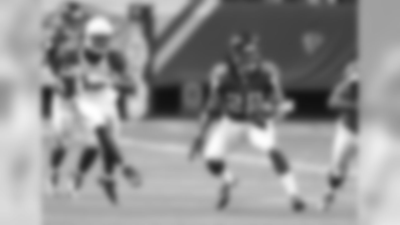 FS Dwight Lowery runs after intercepting the ball.