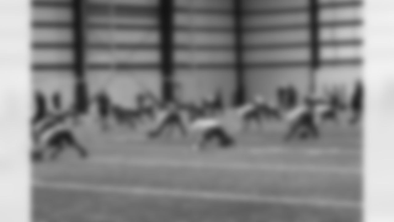 The rookies stretch before their second day of practice