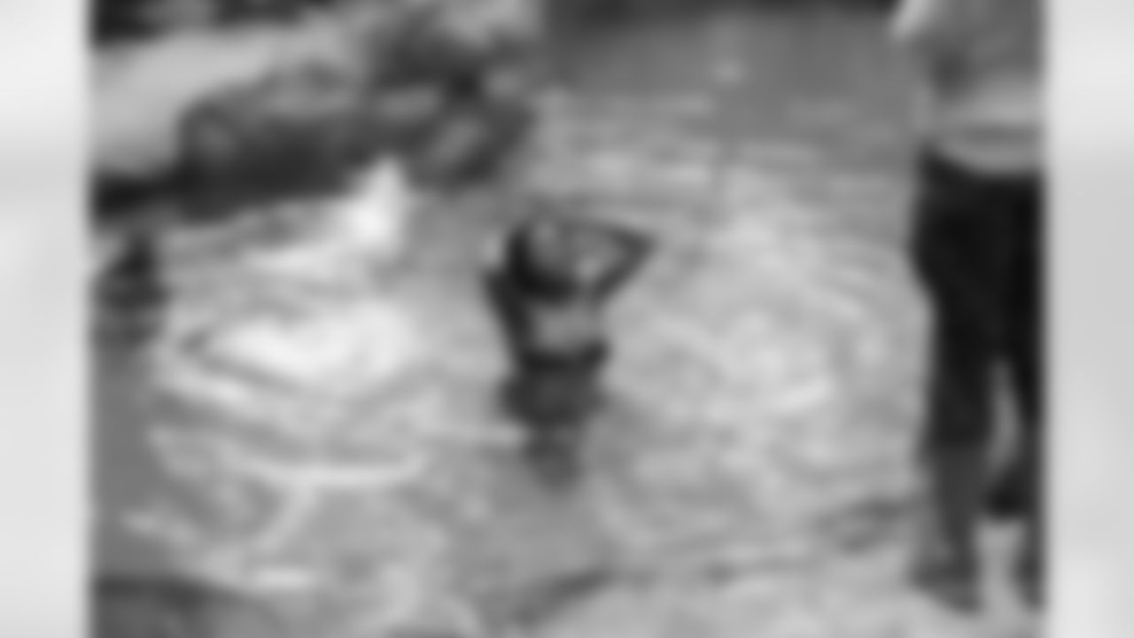 Micki J. wets her hair for a few shots in the pool