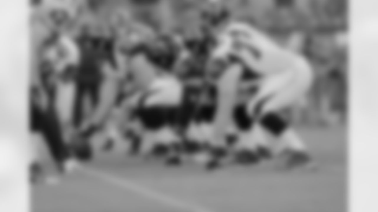 The Falcons' offensive line prepares for the snap