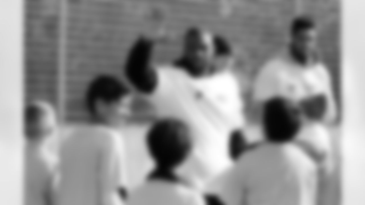 OLB Jacques Smith high fives his group