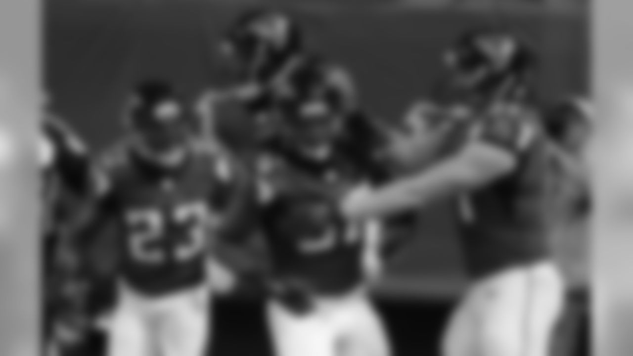 Players celebrate in the endzone after S Kemal Ishmael scores a touchdown off an interception during the game against the Tampa Bay Buccaneers in Week 3.