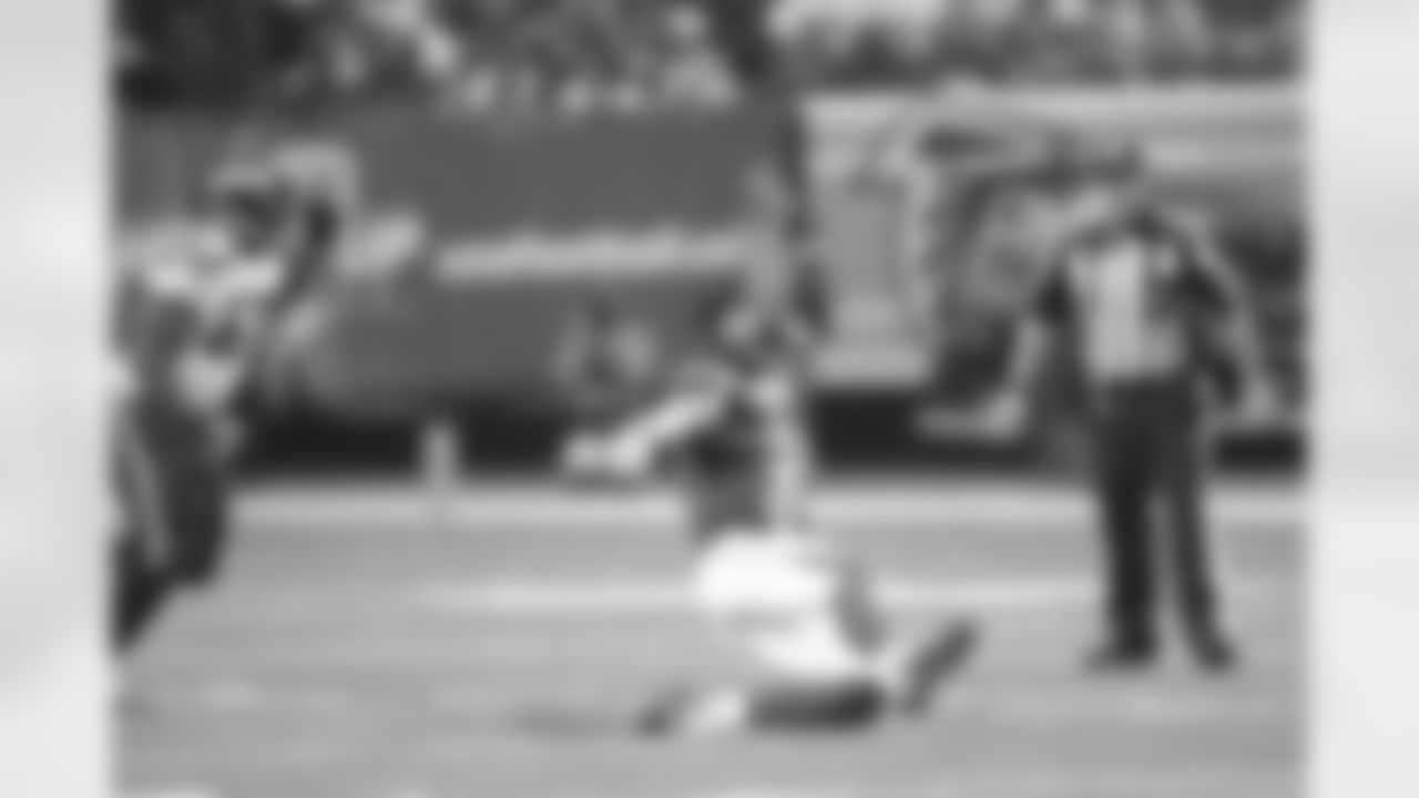 QB Matt Ryan slides after making a run