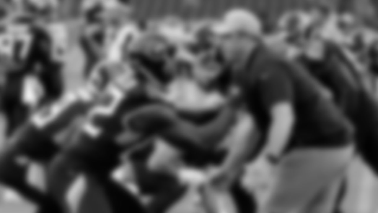Tennessee Titans tight ends coach Arthur Smith, right, helping tight end Delanie Walker (82) warm up before a preseason NFL football game in Nashville, Tenn. (AP Photo/James Kenney, File)