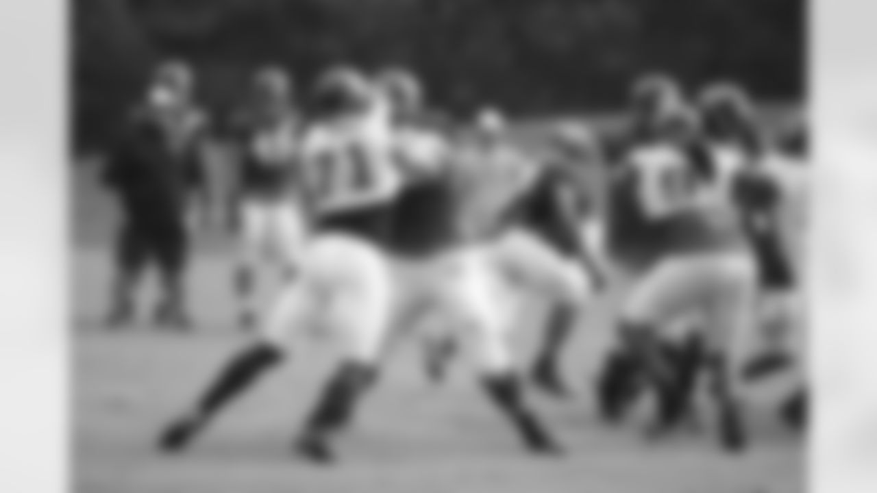 T Jake Matthews practices with DE Kroy Biermann