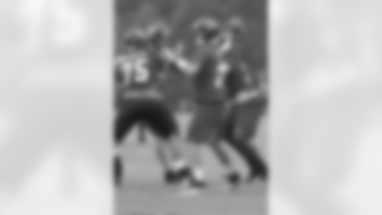 QB Matt Ryan passes behind his line