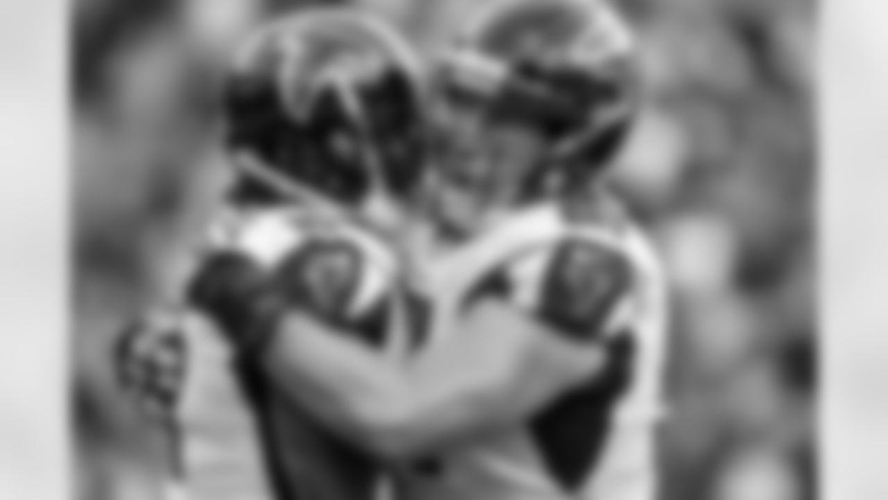 WR Julio Jones is embraced by C Alex Mack