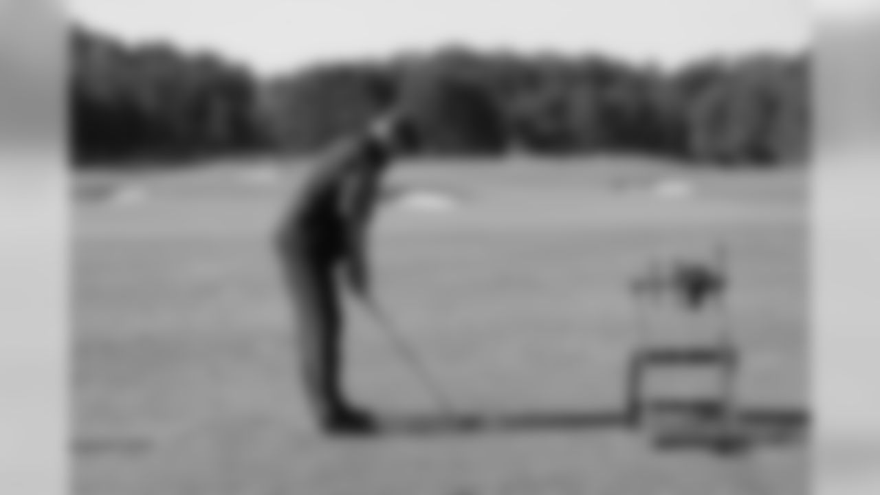Offensive coordinator Dirk Koetter on the driving range
