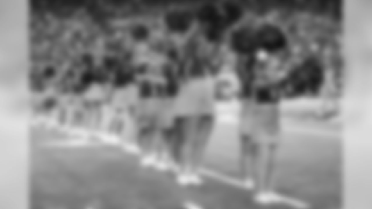 The Atlanta Falcons Cheerleaders and junior cheerleaders used pink pom poms for their performances