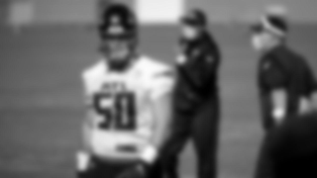 Atlanta Falcons defensive end John Cominsky #50 looks on during practice at IBM Performance Field.
