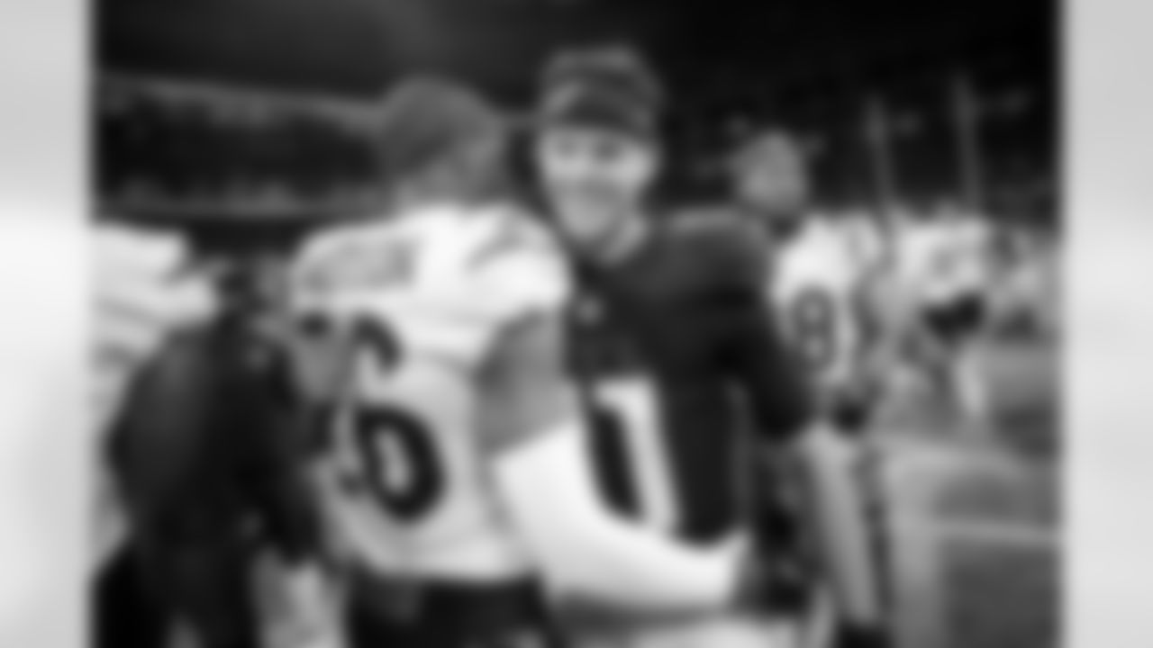 Atlanta Falcons quarterback Logan Woodside #11 with a Bengals player after the Preseason Game against the Cincinnati Bengals at Mercedes-Benz Stadium in Atlanta, Georgia on Friday, August 18, 2023. (Photo by Alex Slitz/Atlanta Falcons)